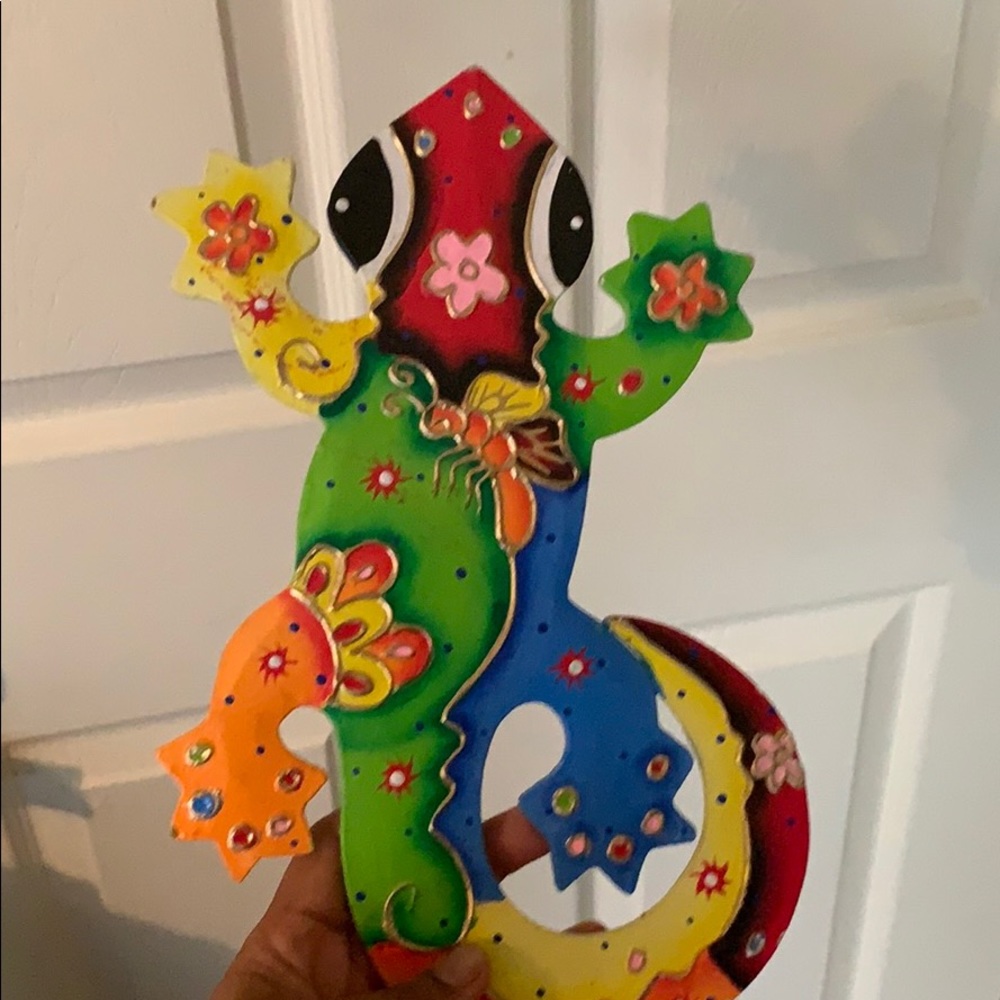 Outdoor decoration. Colorful lizard.